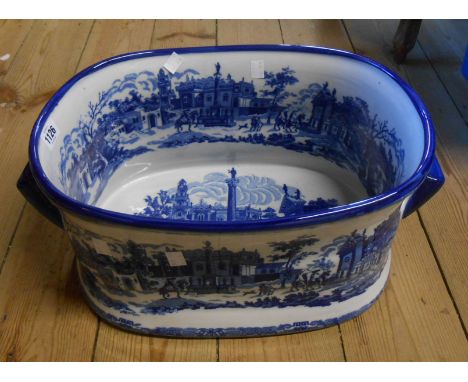 A large modern ceramic foot bath with blue transfer printed decoration