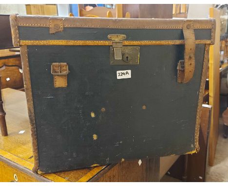 An old lift-top transit trunk