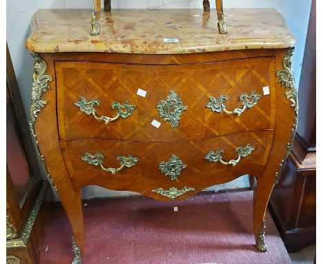 An 86cm French brass mounted kingwood bombe commode in the antique style with marbled top and two deep drawers, set on cabrio