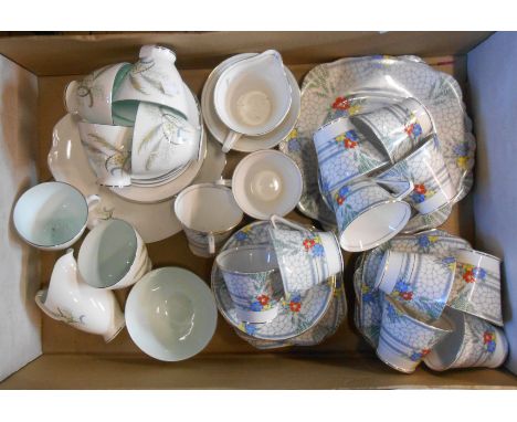 A box containing a Royal Albert bone china part tea set in the Festival pattern comprising five trios, milk and sugar, bread 