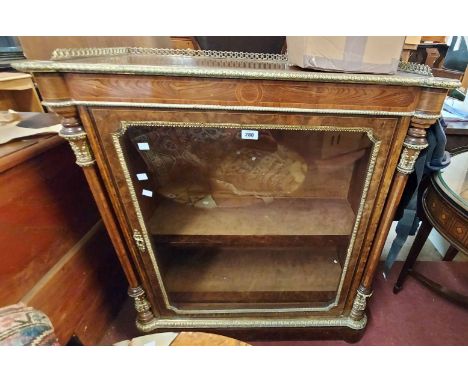 A 94cm antique brass mounted walnut and strung pier cabinet with pierced gallery to top, flanking pillars and material lined 