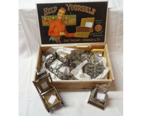 An old cigar box containing a quantity of filigree metal doll's house furniture including dressing table, salon suite, and a 