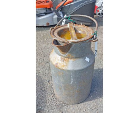A small vintage metal milk churn