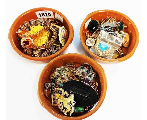 Three ceramic pots containing assorted costume jewellery