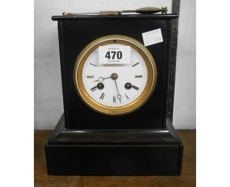 A late Victorian black slate cased small mantel clock with H.L.F eight day bell striking movement