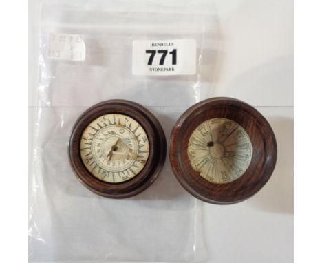 An antique turned rosewood domed screw cased pocket sun dial and compass