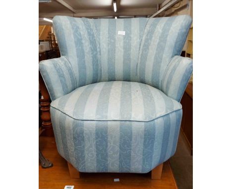 A modern tub elbow chair with blue striped machine tapestry upholstery, set on short tapered legs