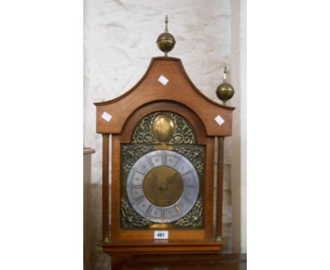 A 20th Century inlaid mixed wood longcase clock with brass and silvered effect arched dial and battery movement