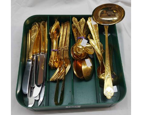 An SBS (German) twelve place setting of cutlery with ornate gold plated handles, including ladle