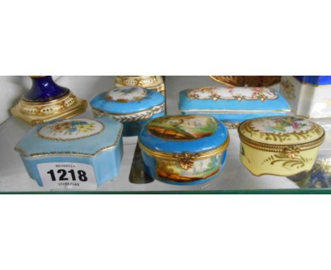 Five continental porcelain trinket boxes each with hand painted decoration