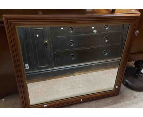 A vintage stained wood framed oblong wall mirror, bearing GWR stamps to back and hardware, set on pommel feet - frame 1.02m X