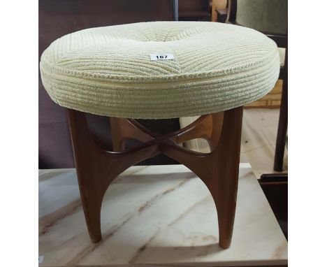 A vintage G-Plan teak framed 'Astro' stool with upholstered seat panel, set on quadruple moulded supports and X-stretcher