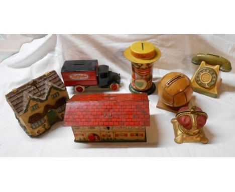 A box containing a quantity of vintage money boxes including a Dr Barnardo's Homes, etc.
