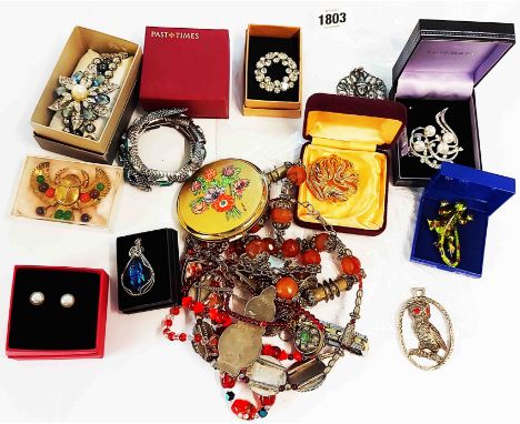 A bag containing a large quantity of assorted ethnic and other costume jewellery boxed and loose including large Trifari gilt