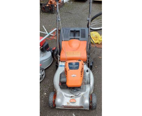 A Flymo Quicksilver 46 SDR petrol lawn mower with Briggs &amp; Stratton '40 Series' 4 stroke engine and grass box