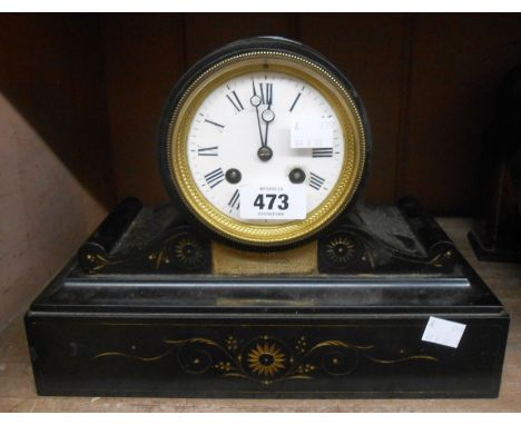 A late Victorian black slate cased drum and scroll mantel clock with eight day bell striking movement (bell missing) and bear