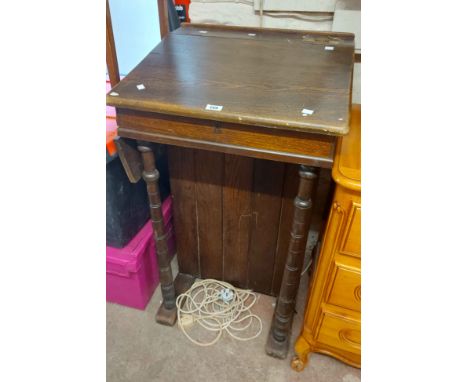 A 60cm late Victorian oak lectern with lift-top reading surface and brass inkwell marked for A. Wheaton &amp; Co (Exeter), se