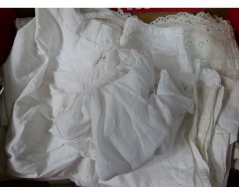 A quantity of Victorian adult clothing to include undergarments, night gowns in white cotton, combination sets, crocheting se