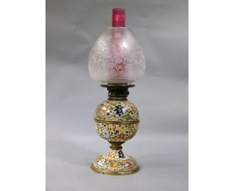 Ceramic and brass oil lamp having a globular reservoir and circular domed base, cranberry glass chimney and an opaque and etc