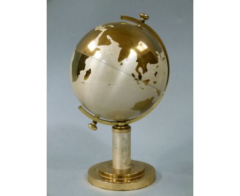 A globe shaped cigarette dispenser in brass 