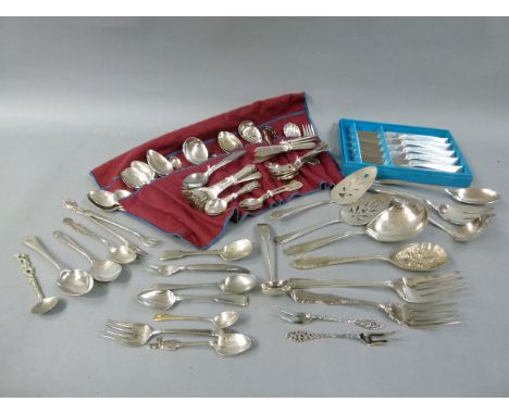 A collection of silver plated cutlery including serving spoons, forks and slices, dessert servers, ladle, pickle fork, set of