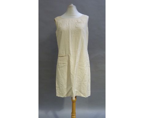 A 1960s cream silk sleeveless shirt dress with pocket detail 