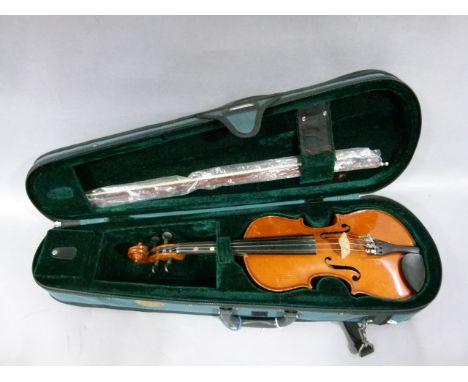 A students violin, the two piece back of of medium curl, ribs conforming, the table of broad grain, length of back 31.5cm; to