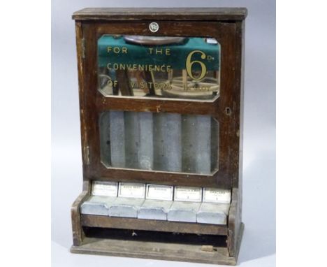 A BAC Ltd dispensing machine, the mirrored upper section inscribed: 'For The Convenience of Visitors, 6d in slot', glazed pan