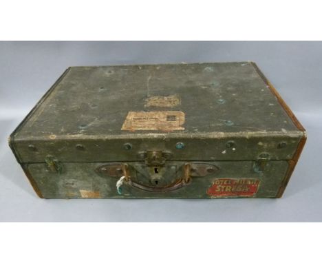 A vintage olive green fabric suitcase with brown leather trim each side with triangular applied brass label engraved with a f