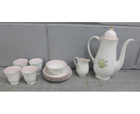 A Susie Cooper Design Romance pink pattern four setting tea service, eleven pieces in total, small chip to cream 