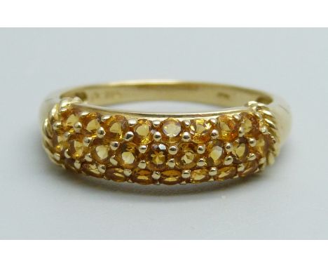 A 10k gold, triple row citrine ring, 2.2g, P 