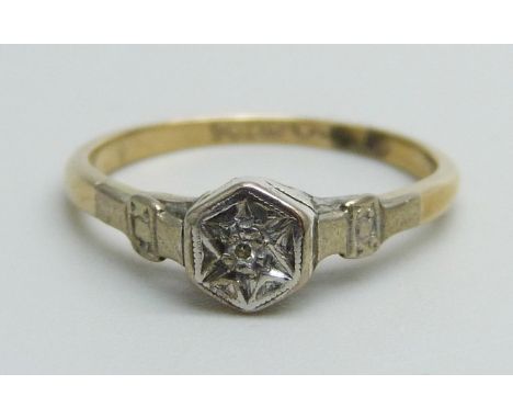 A 9ct gold and platinum ring set with a small diamond, 1.6g, K 