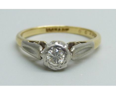 An 18ct gold and platinum set diamond solitaire ring, 2.8g, L 