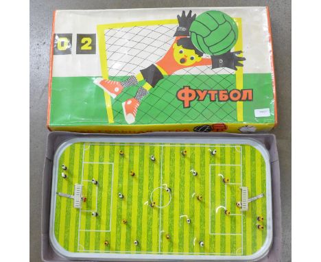 A vintage Soviet football metal stadium board game, spring players, 56 x 30 x 7.5cm 