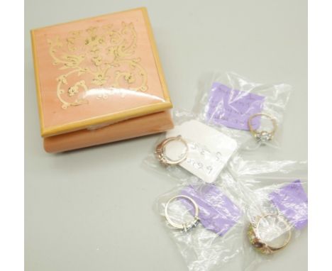 Three silver-gilt rings and a gilt multi-gem set ring, J, L, N and Q 