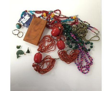 A collection of costume jewellery including a graduated malachite bead necklace, a coral bead necklace, a gilt chain, jadeite