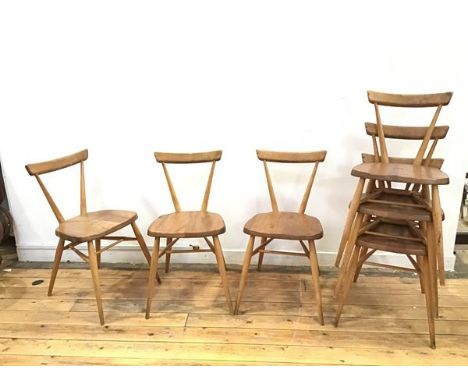 A set of six Ercol stacking chairs, original design by Lucian Ercolani, 1957, the curved top rail on flared supports, on a li