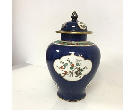 A 1920s/30s Staffordshire lidded vase of urn form in the Worcester Blue scale style, lid with repairs, stamped to base with a