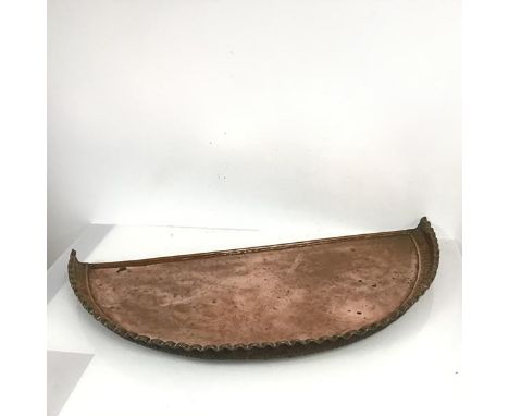 A semi circular copper shelf or table top with raised front piecrust edge (79cm x 37cm)