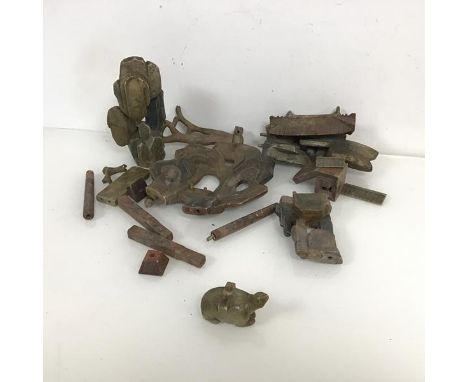 A group of Chinese soapstone fragments from a garden sculpture including turtle (4cm x 8cm x 4cm), stones, roof tops, archite