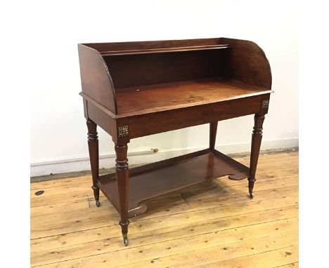 A 19thc mahogany French wash stand, the three quarter gallery back incorporating a shelf, above a plain frieze, embellished w