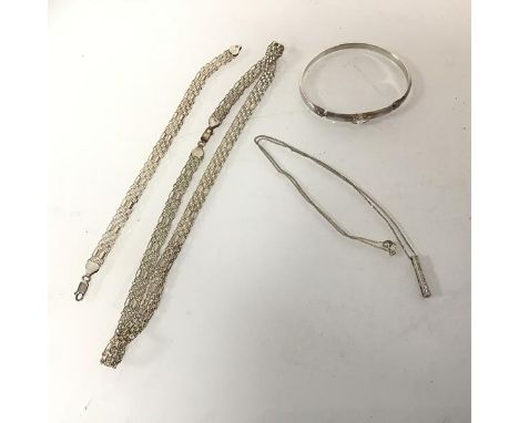 A silver chain with a vertical bar pendant, a silver fancy link chain necklace with matching bracelet and a silver bangle wit