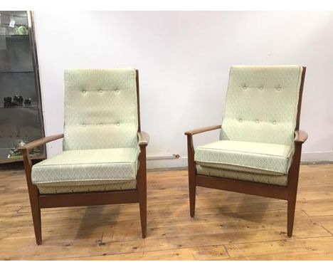 A pair of Cintique armchairs with green tone geometric pattern upholstery, the button backs over a loose seat cushion, on squ