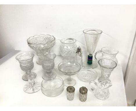 An assortment of glass and crystal including vases, a water pitcher, a sugar castor, a tazza, coasters, a candlestick holder 