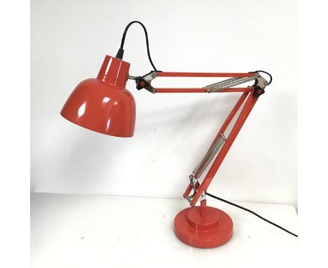 An anglepoise style lamp with domed shade and a two tier circular base in coral pink (h.76cm x d.17cm)