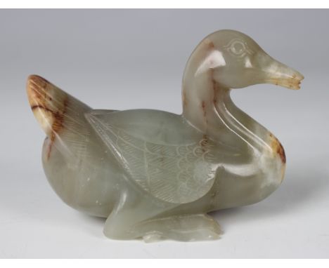 A Chinese pale celadon jade carving of a duck, Qing dynasty or later, the celadon coloured stone with russet and cream inclus