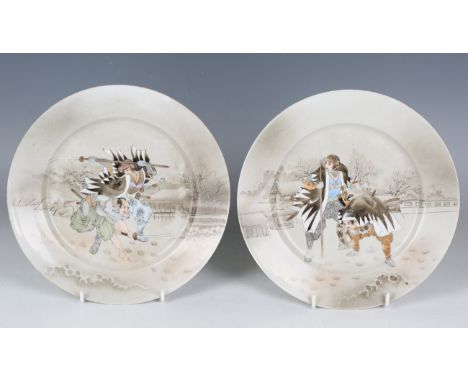 A set of four Japanese Kutani porcelain plates, Meiji period, each painted with a scene of two samurai, diameters 21.2cm, tog