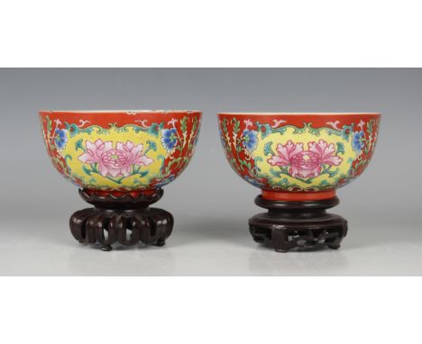 A pair of Chinese coral-ground famille rose porcelain bowls, mark and period of Qianlong, each of steep-sided circular form w