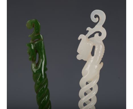 A Chinese white jade hairpin, late 20th century, with carved dragon head finial above a pierced openwork and spiral shaft, le