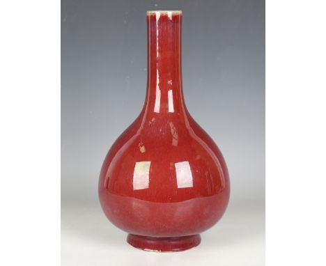 A Chinese sang-de-boeuf glazed bottle vase, mark of Qianlong but probably 20th century, the globular body and narrow cylindri